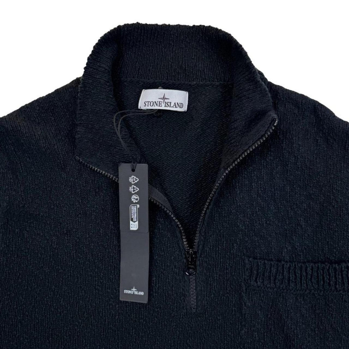 Stone Island black knit jumper with logo patch and cotton-linen blend material.
