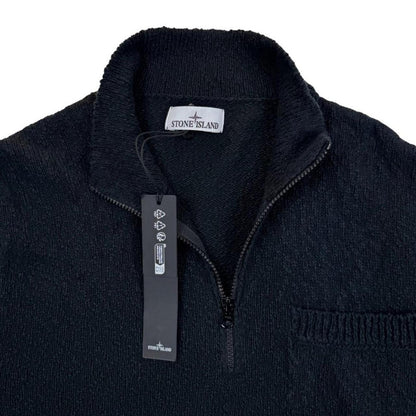 Stone Island black knit jumper with logo patch and cotton-linen blend material.