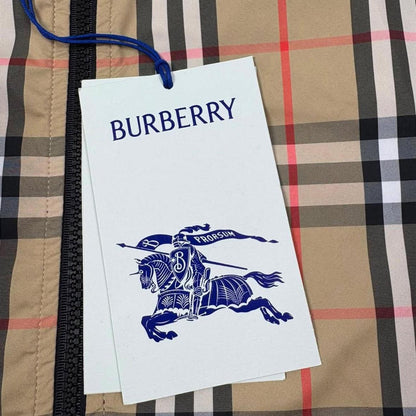 Burberry reversible windbreaker jacket in sand beige and black Nova Check pattern.