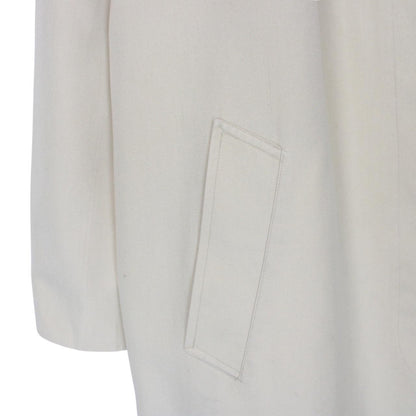 Burberry cream trench coat, single breasted, vintage 80s style, visible mark on sleeve.