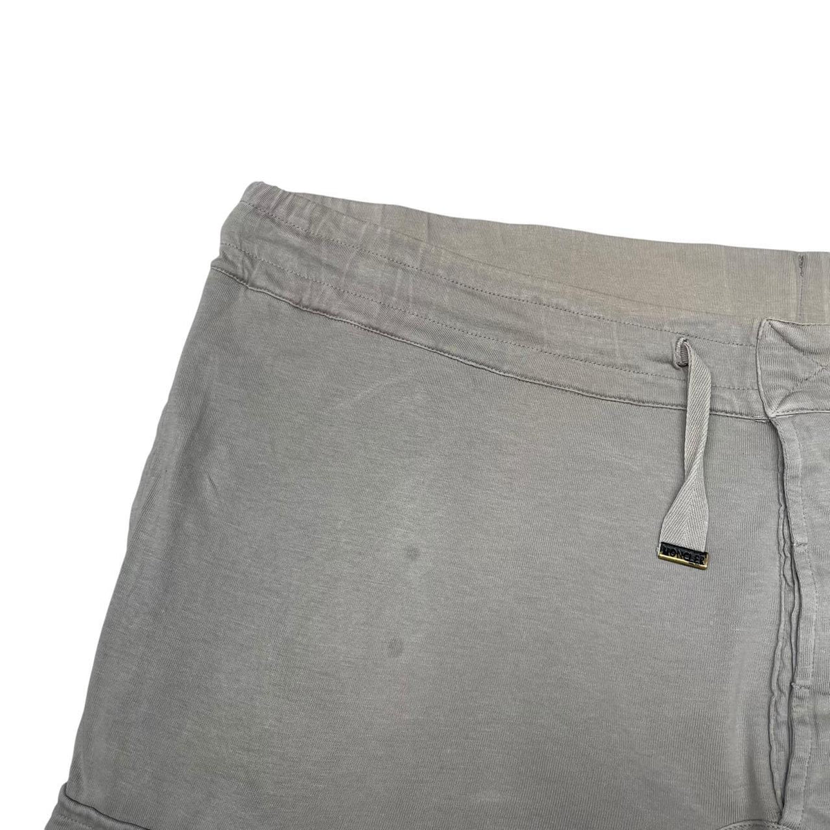 Moncler grey jogger shorts cotton material with logo detail and minor marks.