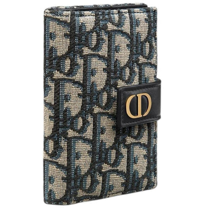 Dior blue card holder featuring Oblique jacquard pattern and dandelion design.