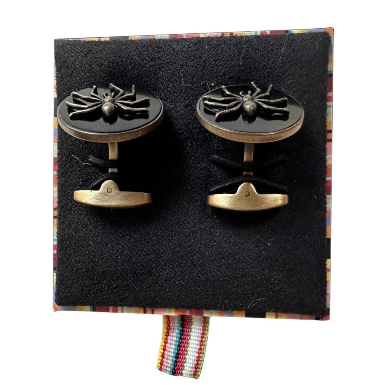 Paul Smith gunmetal cufflinks 2D spider design with intricate detailing and brand logo.