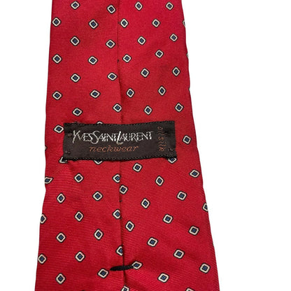 Yves Saint Laurent red silk tie with subtle sheen and vintage design.