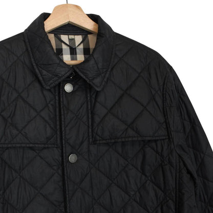 Burberry black quilted field jacket with Nova Check lining and diamond pattern.