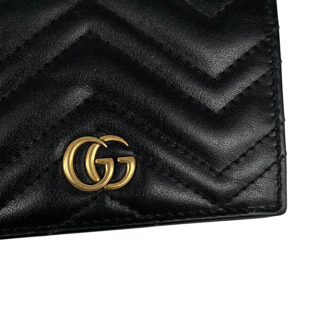 Gucci black calfskin card case wallet with matelasse pattern and GG logo.