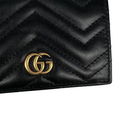 Gucci black calfskin card case wallet with matelasse pattern and GG logo.