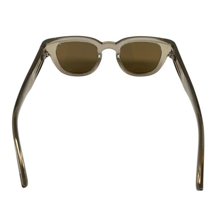 Saint Laurent transparent sunglasses with logo print, modern design, brand new condition.