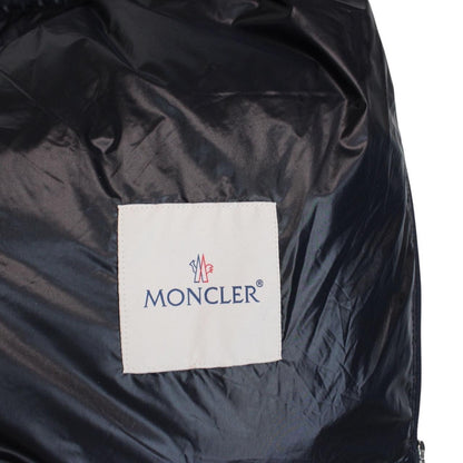 Moncler navy blue down gilet with logo patch and quilted design.