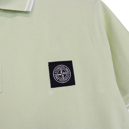 Stone Island green polo shirt with compass logo, cotton material, short sleeves.