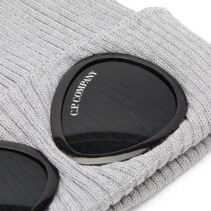 CP Company grey beanie hat with goggle detail and cotton material.