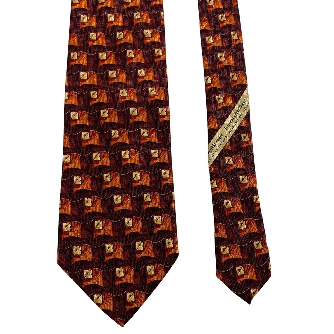 Ermenegildo Zegna brown and orange silk tie with abstract print design.