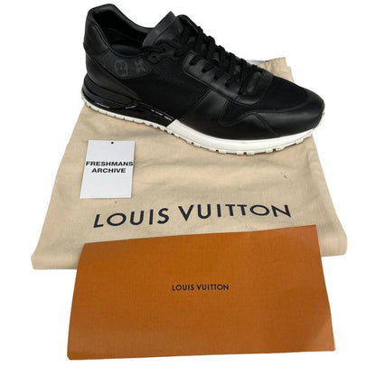 Louis Vuitton black trainers featuring monogram pattern and leather-mesh material.