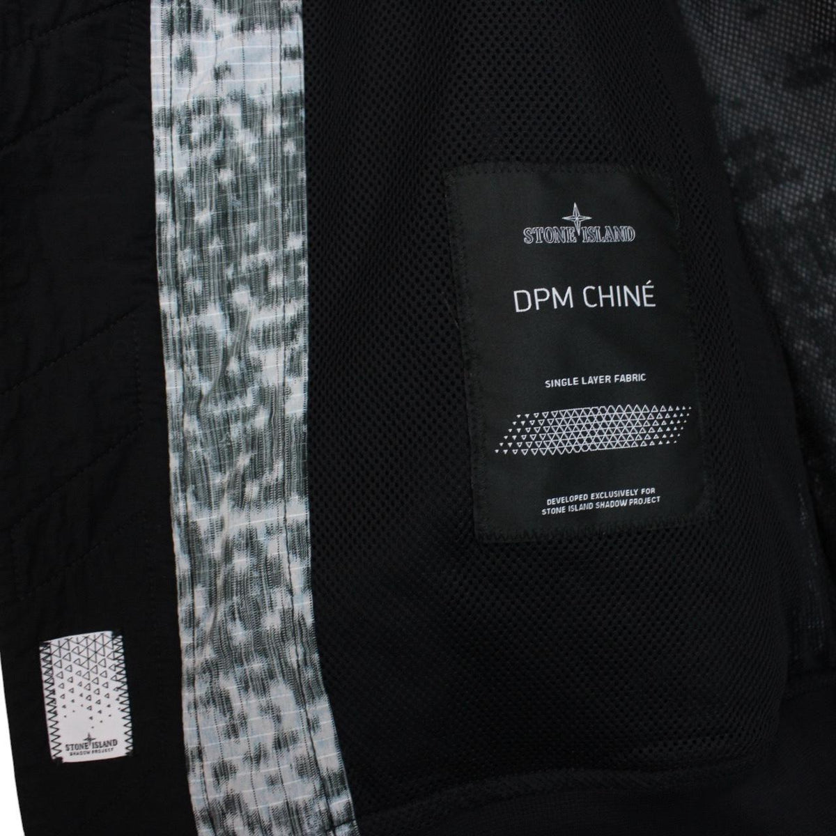 Stone Island bomber jacket grey marl with embroidered compass logo and unique pattern.