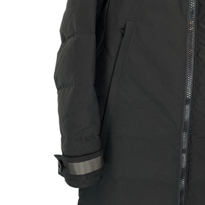 Canada Goose black parka with fur trim, logo patch, and down insulation.