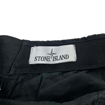 Stone Island navy blue joggers with logo patch and nylon material.