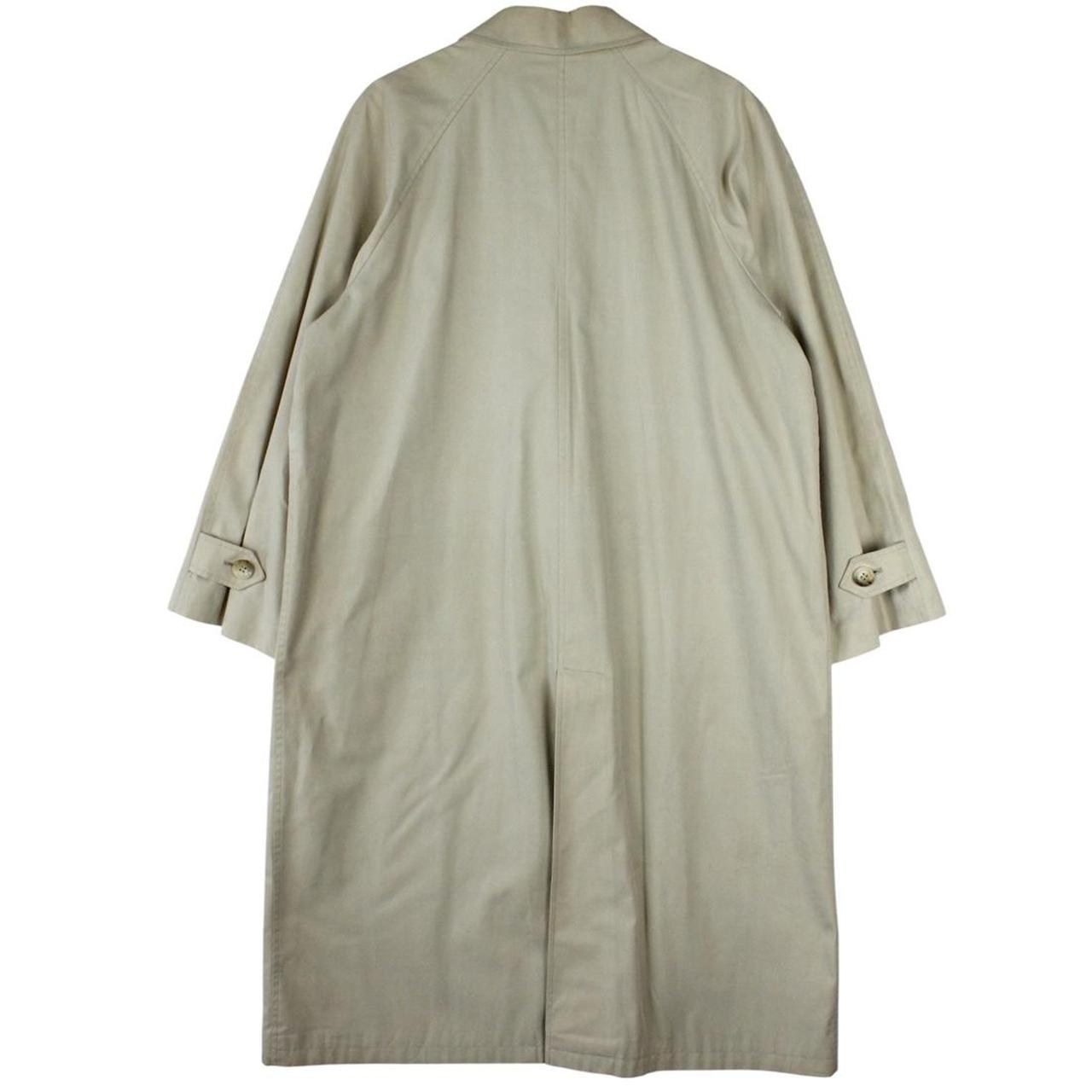 Burberry beige trench coat featuring iconic Nova Check pattern and single breasted design.