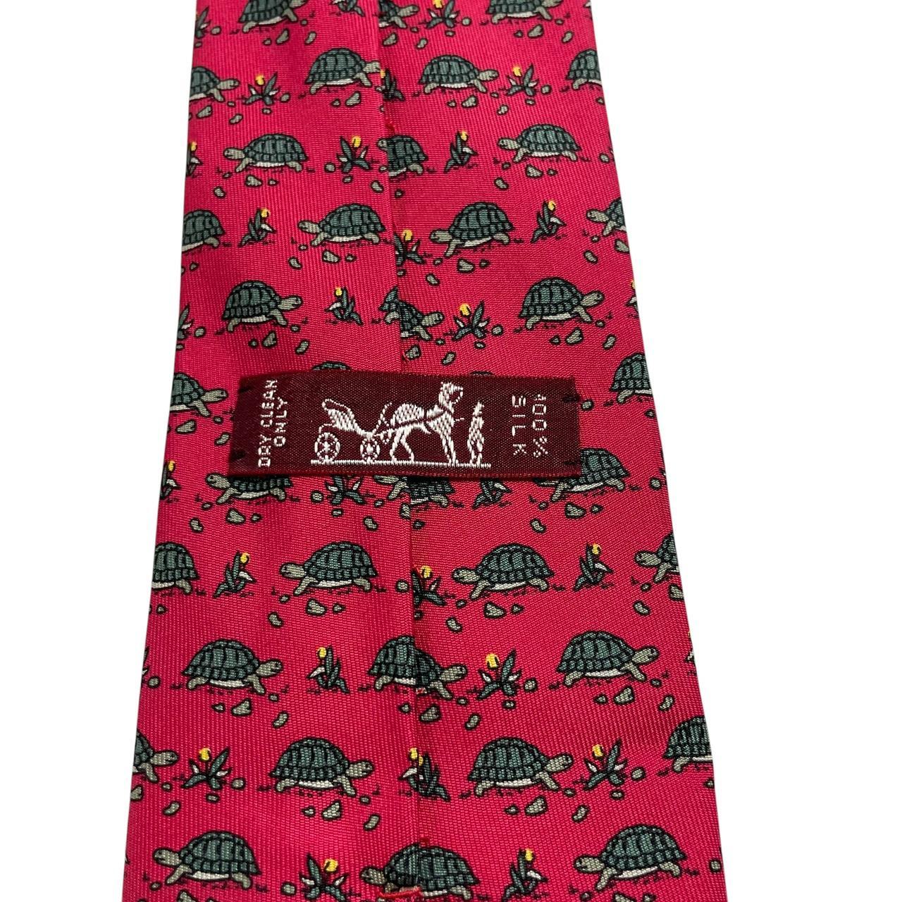 Hermes green and red silk tie featuring turtle print design and logo.
