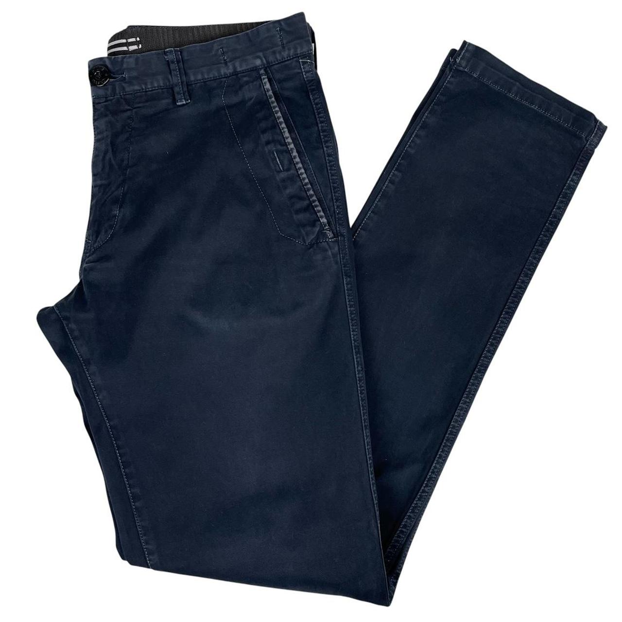 Stone Island navy blue slim fit cotton trousers with logo patch and clean design.