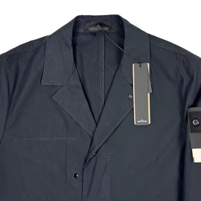 Stone Island navy blue jacket weatherproof cotton canvas with ghost logo detail.