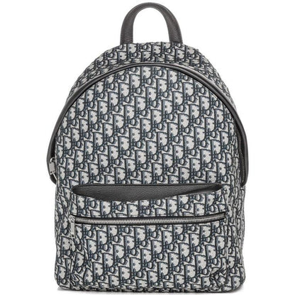 Dior beige and black oblique jacquard monogram rider backpack with logo pattern.