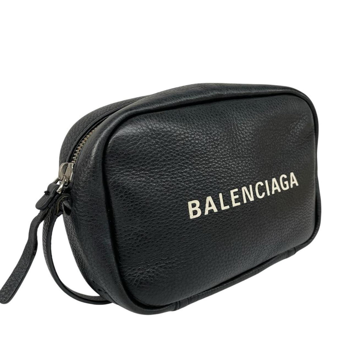 Balenciaga black leather messenger bag with embossed logo and minimalistic design.