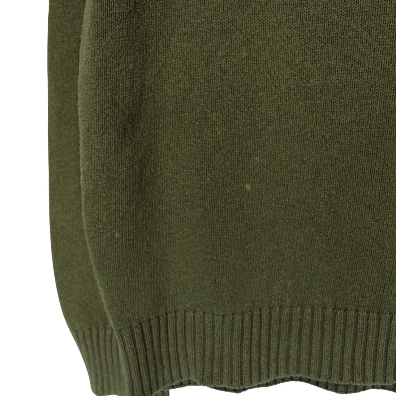 Stone Island green v-neck cotton knit jumper with logo patch and visible wear.