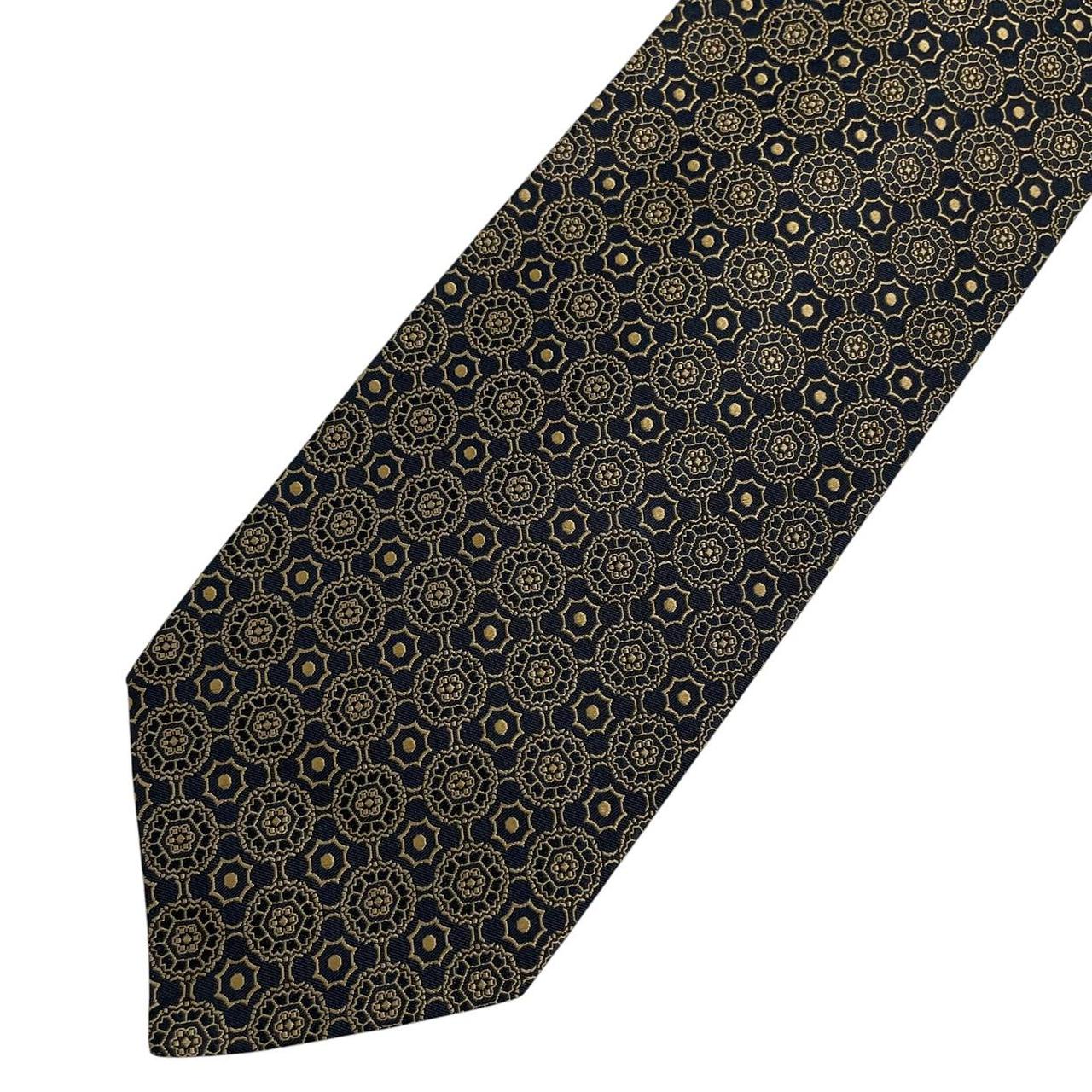 Polo Ralph Lauren black and gold silk tie with geometric print design.