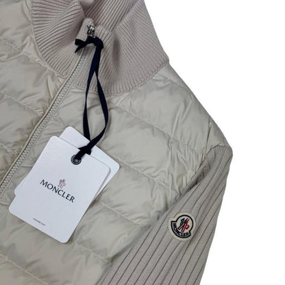 Moncler beige full zip jacket with logo detail and nylon/wool blend material.