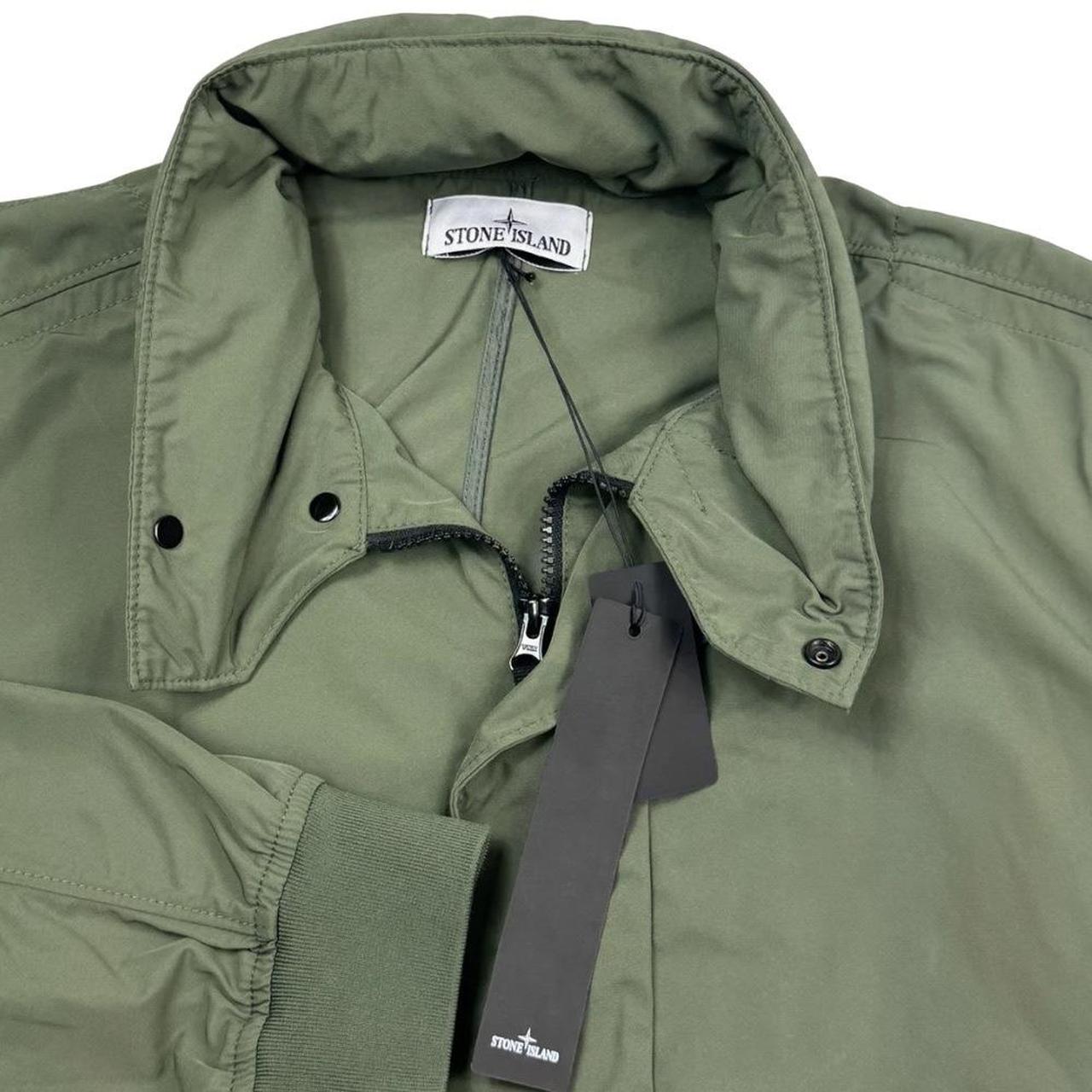 Stone Island green full zip micro twill jacket with removable woven brand patch.