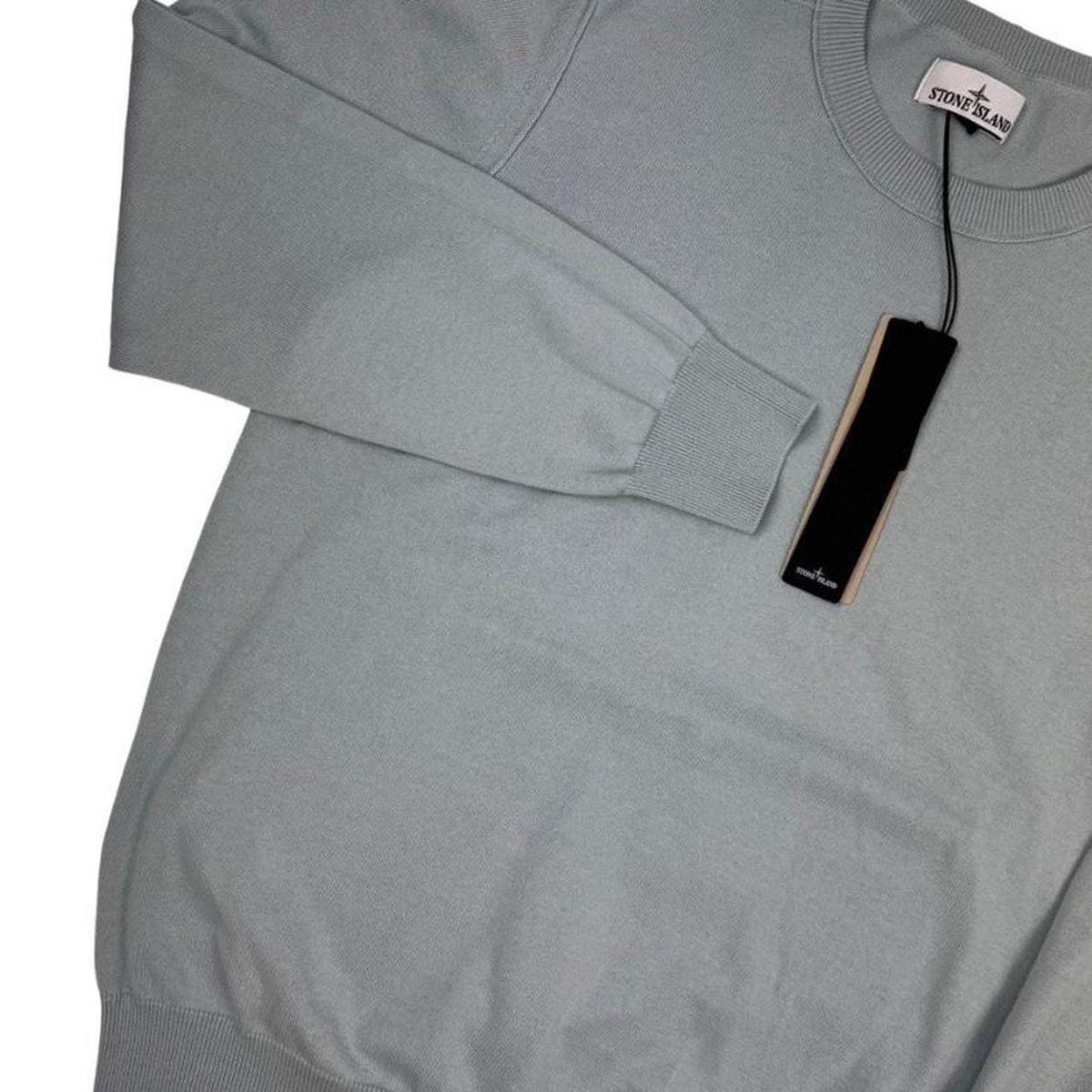 Stone Island grey knit jumper made from organic cotton with logo patch on sleeve.