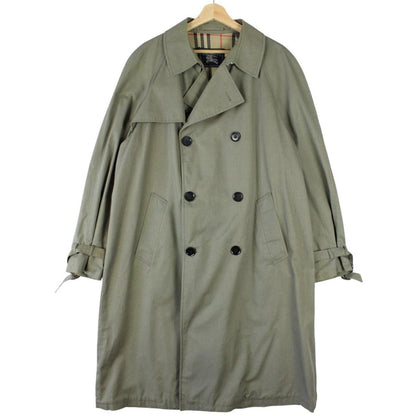 Burberry khaki green trench coat featuring Nova Check pattern and double-breasted design.