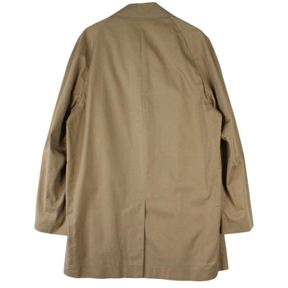 Aquascutum tan brown trench coat with house check pattern and removable wool lining.