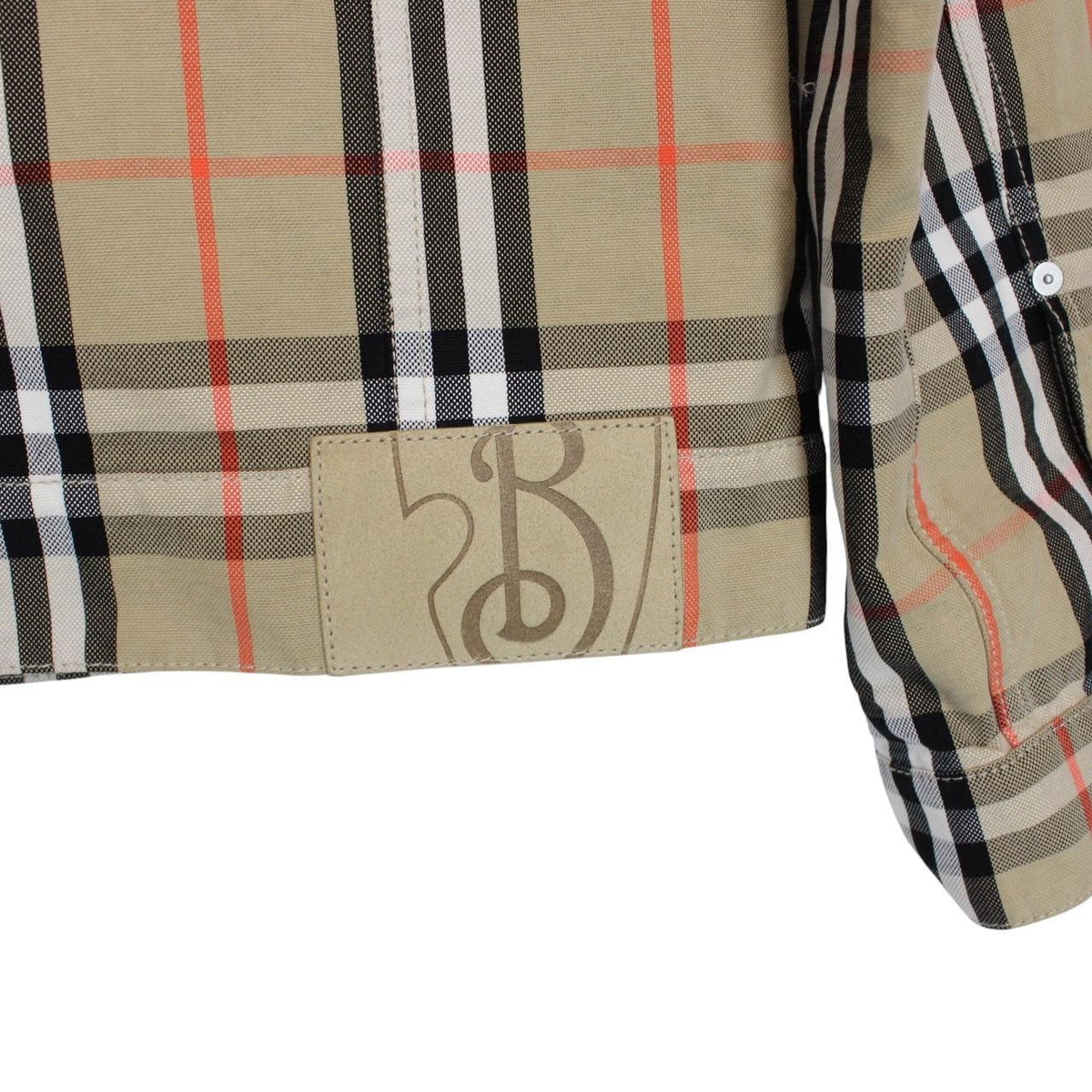 Burberry beige denim jacket featuring iconic Nova Check pattern and logo detail.