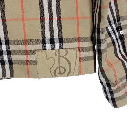 Burberry beige denim jacket featuring iconic Nova Check pattern and logo detail.