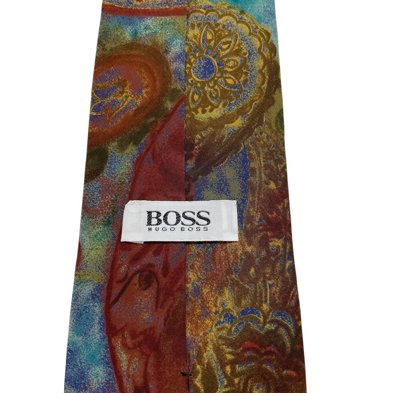 Hugo Boss multicoloured silk tie with abstract pattern in blue and green tones.