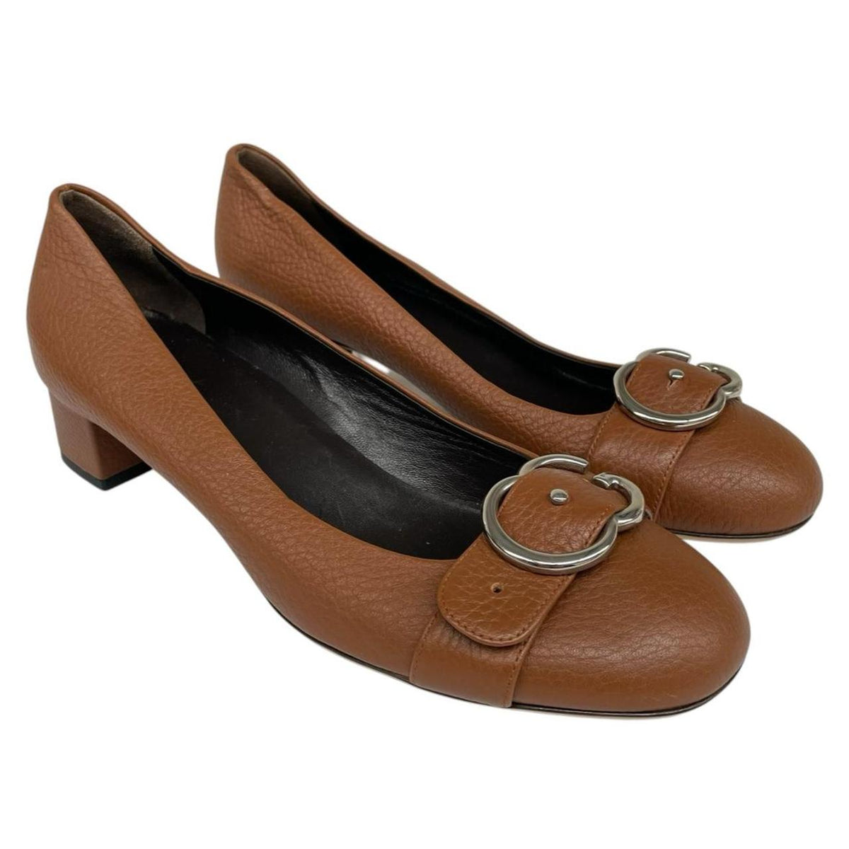 Gucci brown high heels with pebbled leather and interlocking G buckle detail.