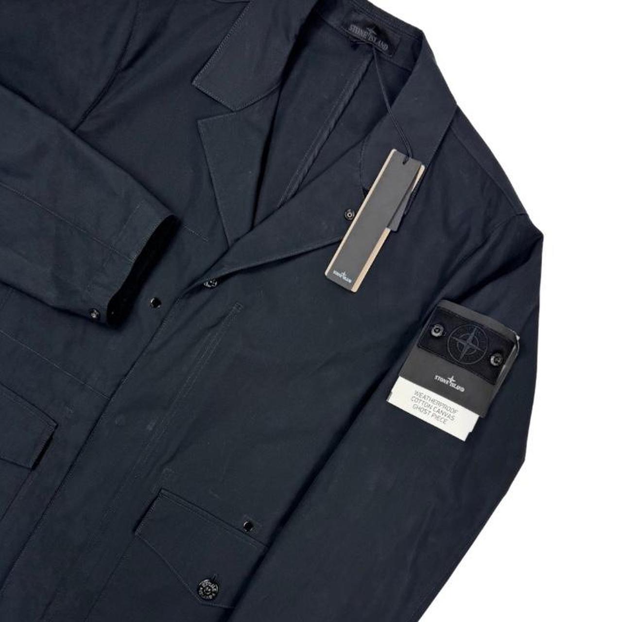 Stone Island navy blue jacket weatherproof cotton canvas with ghost logo detail.