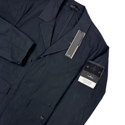 Stone Island navy blue jacket weatherproof cotton canvas with ghost logo detail.