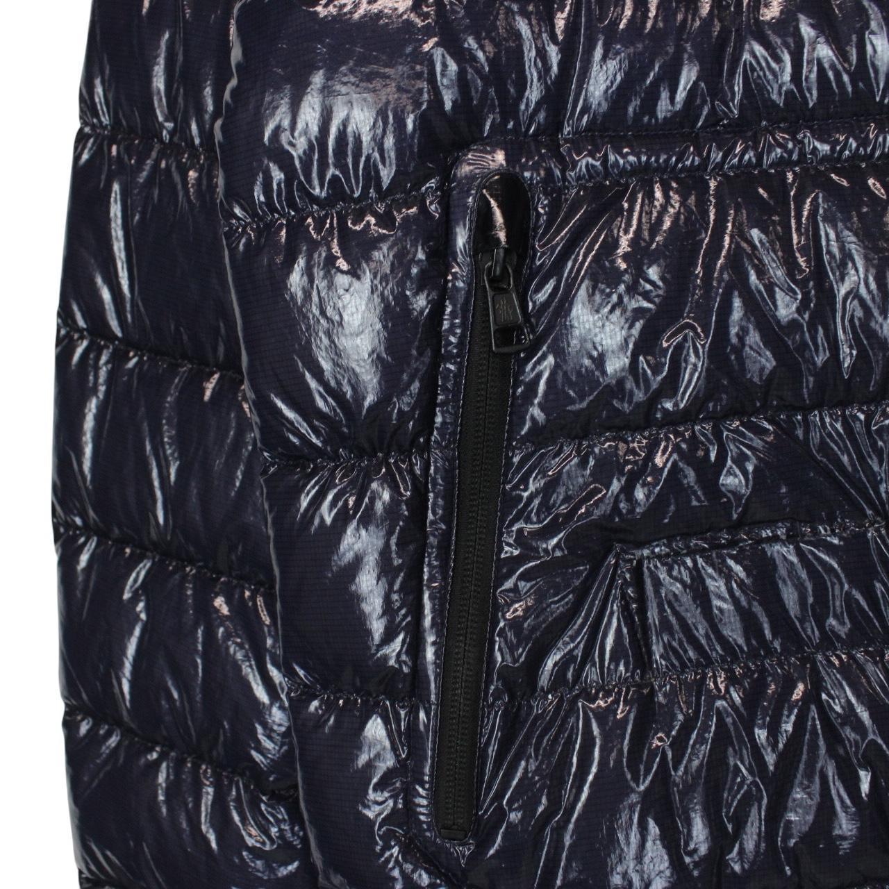 Moncler navy blue full zip down jacket with logo patch and quilted material.