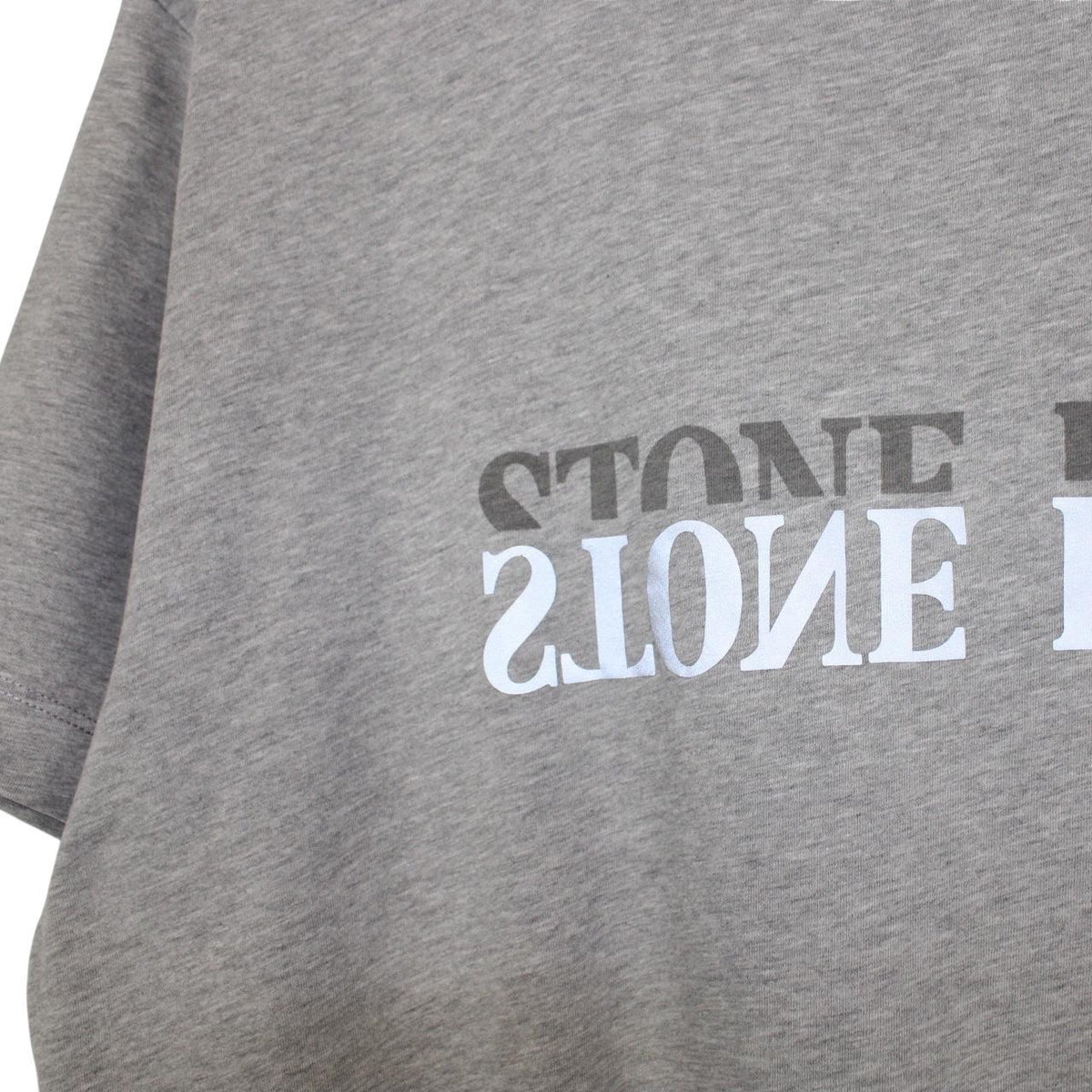 Stone Island grey short sleeve t-shirt with reflective logo and cotton material.