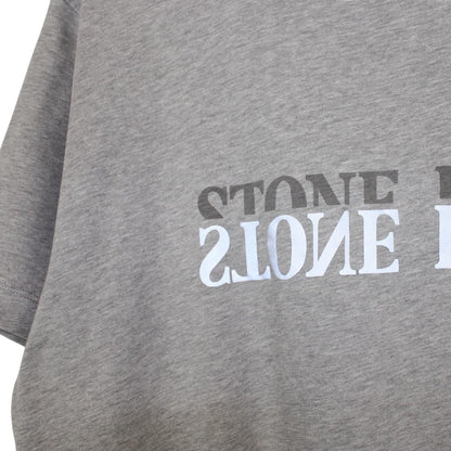Stone Island grey short sleeve t-shirt with reflective logo and cotton material.
