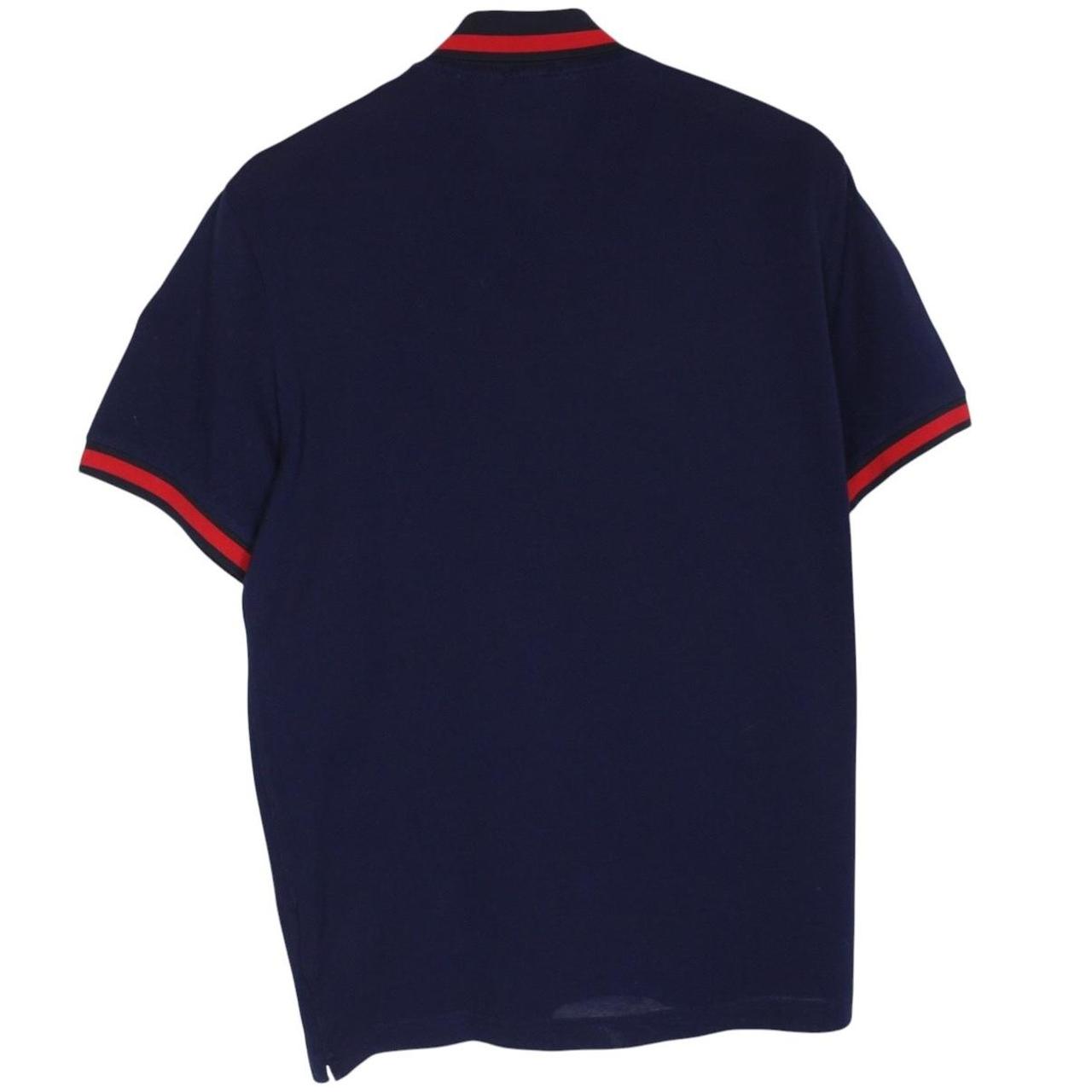Moncler navy blue short sleeve polo shirt with embroidered logo and cotton material.
