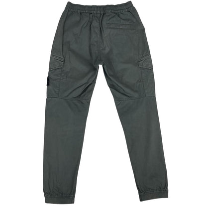 Stone Island grey cargo trousers with logo patch and pockets, visible discolouration.