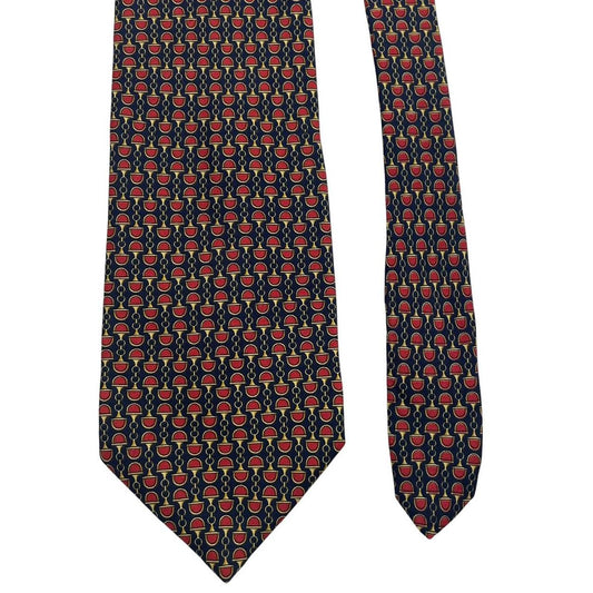 Gucci silk tie red and navy blue horsebit pattern with logo detail.
