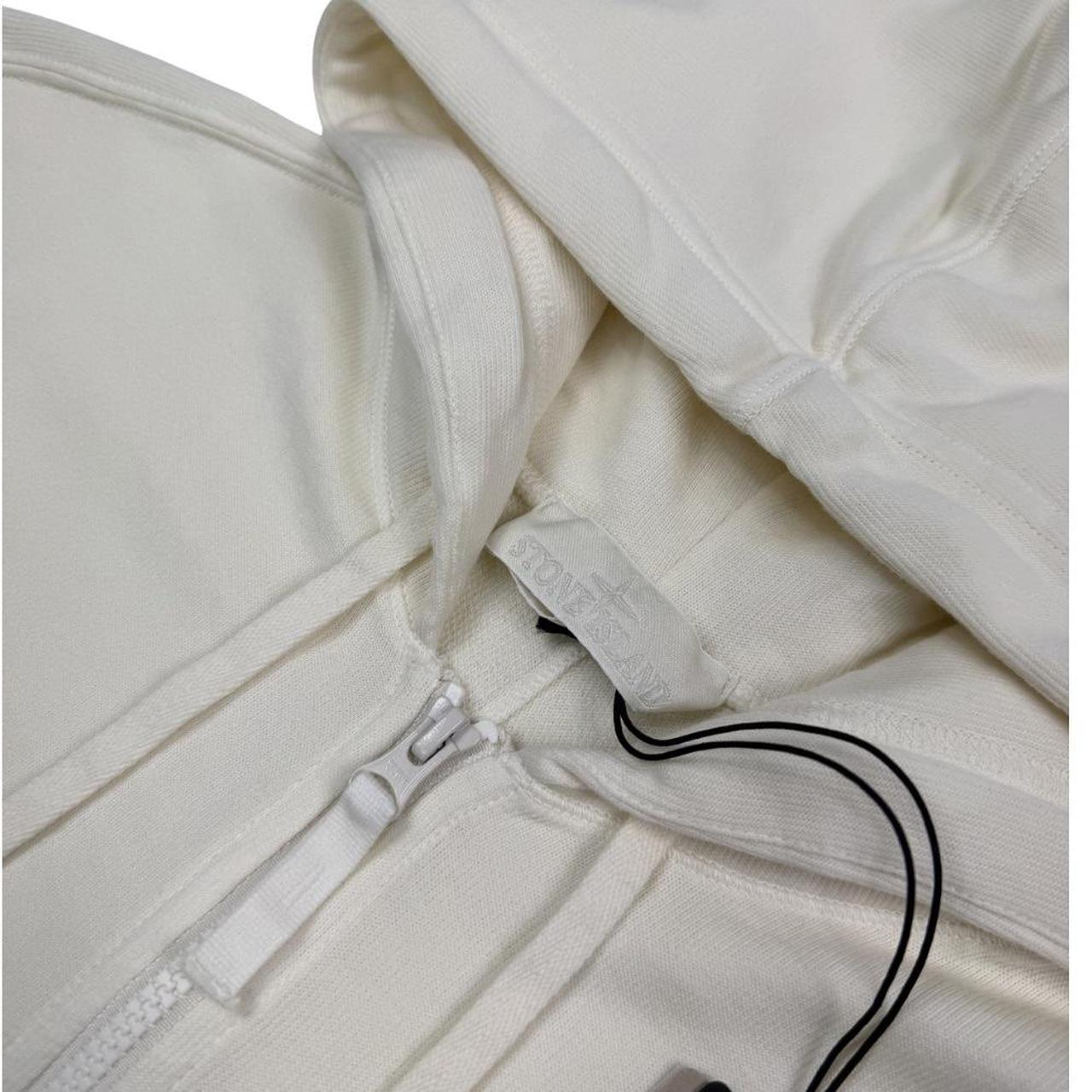 Stone Island cream full zip hoodie with ghost logo and cotton material.