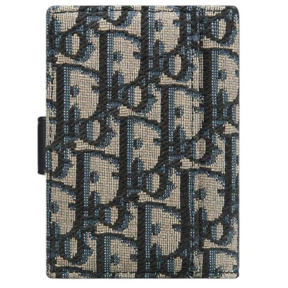 Dior blue card holder featuring Oblique jacquard pattern and dandelion design.