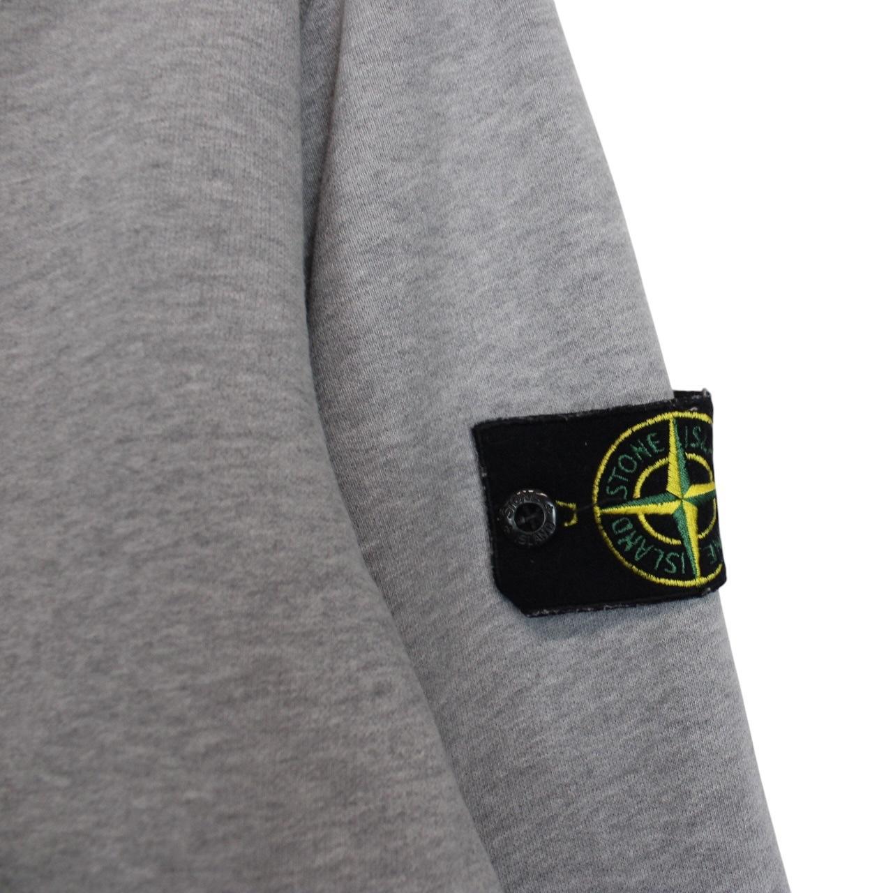 Stone Island grey cotton sweatshirt with logo patch and faint mark on sleeve.
