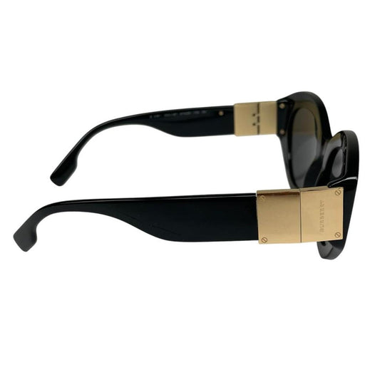 Burberry cat eye sunglasses black and gold with logo detail and case.