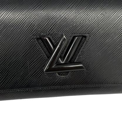 Louis Vuitton black Epi leather duffel bag with twist lock and visible wear.